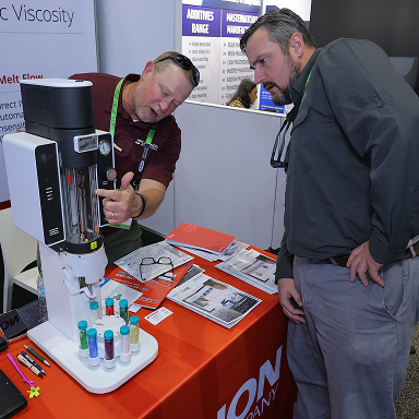 Industry professionals examining equipment